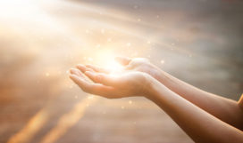 Woman hands praying for blessing from god on sunset background Woman hands praying for blessing from god on sunset background